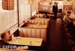 A Diner With A Sign That Says Ice Cream In The Back GIF