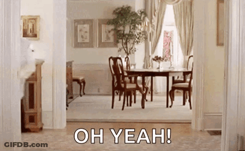 A Dining Room With A Table And Chairs And The Words `` Oh Yeah '' Written On The Bottom . GIF