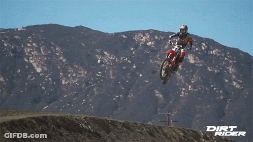 A Dirt Rider Is Jumping In The Air GIF