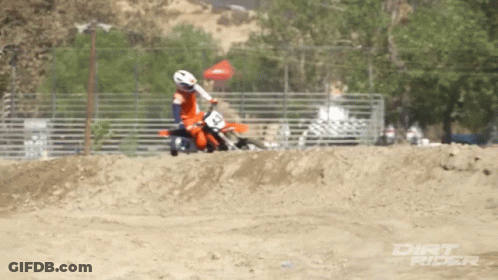 A Dirt Rider Is Riding A Dirt Bike GIF
