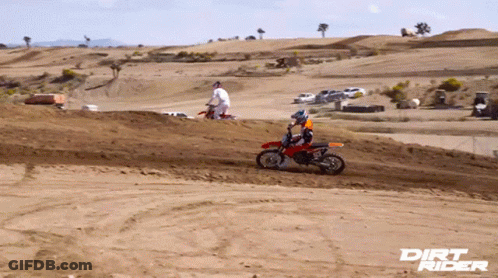 A Dirt Rider Poster Shows A Man Riding A Dirt Bike On A Dirt Track GIF