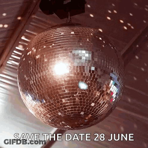 A Disco Ball Is Hanging From The Ceiling With The Words Save The Date 28 June Below It GIF