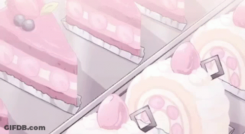 A Display Case Filled With Pink And White Cakes And Pastries . GIF
