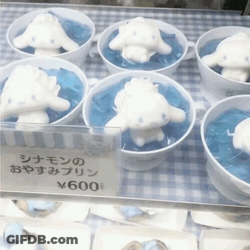 A Display Of Cinnamon Rolls In Cups With A Price Tag Of 600 Yen GIF