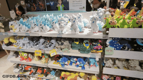 Stuffed Animals Display With Pokemon Sign GIF