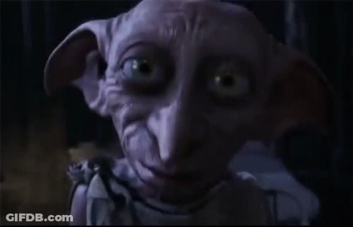 A Dobby From Harry Potter Says Hello In The Dark GIF