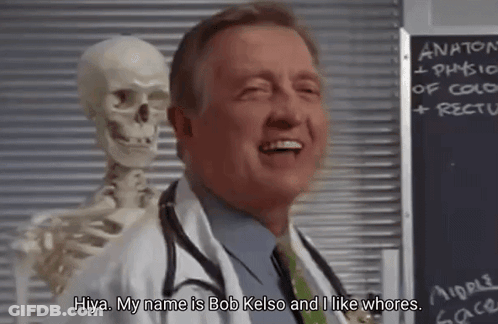 A Doctor Is Standing Next To A Skeleton And Smiling . GIF