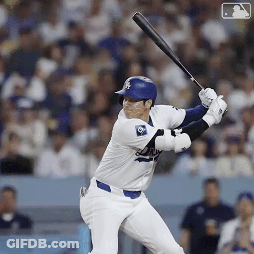 A Dodgers Baseball Player Is Swinging At A Pitch GIF