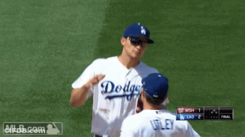 A Dodgers Baseball Player Is Talking To Another Player GIF