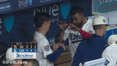 A Dodgers Baseball Player Shakes Hands With A Coach GIF