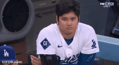 A Dodgers Baseball Player Sits In The Dugout GIF