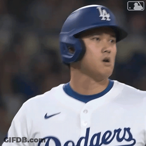 A Dodgers Baseball Player Wearing A Helmet And A White Shirt GIF