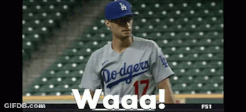 A Dodgers Baseball Player Wearing A Number 17 Jersey Stands On The Field GIF