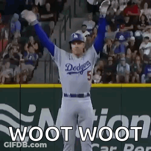 A Dodgers Baseball Player With His Arms In The Air GIF