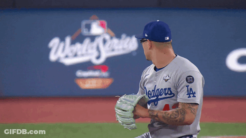 A Dodgers Pitcher Getting Ready To Throw A Baseball GIF