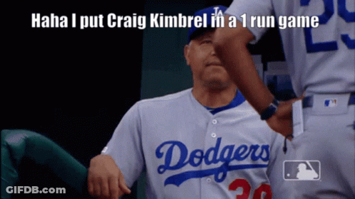 A Dodgers Player Is Getting A High Five From A Teammate GIF