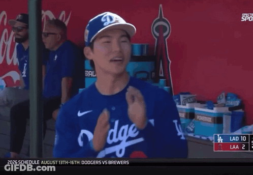 A Dodgers Player Is Smiling In The Dugout GIF