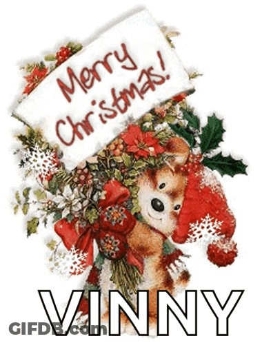 A Dog Holding A Sign That Says Merry Christmas GIF