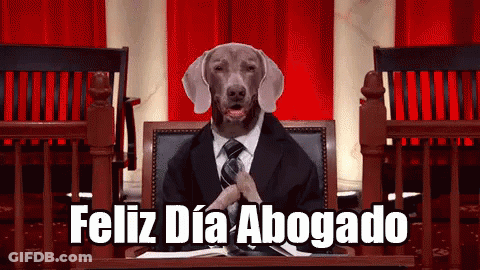 A Dog In A Suit And Tie Is Sitting At A Podium With The Words " Feliz Dia Abogado " Below It GIF