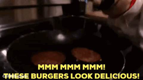 A Dog Is Looking At Burgers In A Frying Pan And Says " Mmmm Mmmm Mmmm " GIF