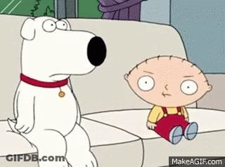 A Dog Is Sitting On A Couch Next To A Baby . GIF