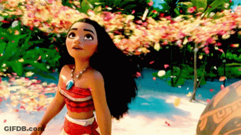 A Doll From The Movie Moana Is Standing In Front Of A Lush Green Forest . GIF