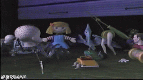 A Doll In A Blue Dress Standing Next To A Dinosaur GIF