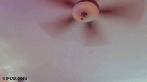 A Doll Is Being Held By A Person In A Bathtub And Being Played With . GIF