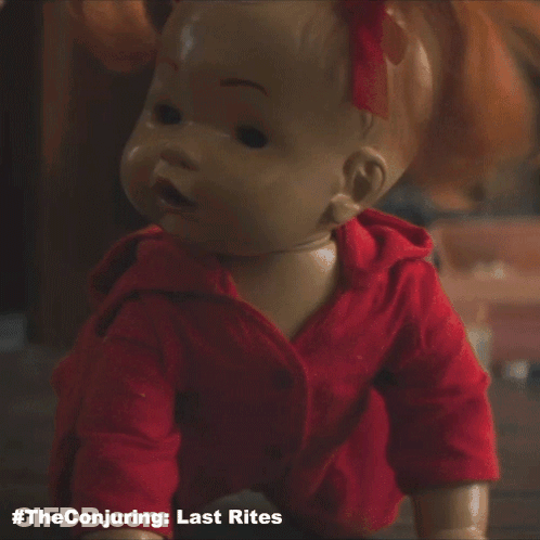 A Doll Is Crawling On The Floor With The Conjuring Last Rites Written Underneath It GIF