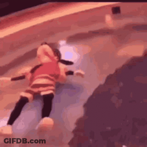 A Doll Is Laying On The Ground In A Pool . GIF