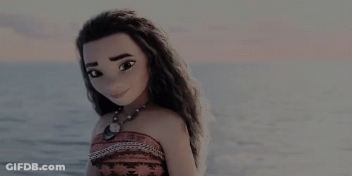 A Doll Is Standing On The Beach Near The Ocean . GIF