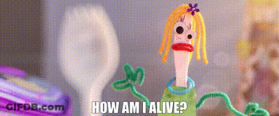 A Doll Made Out Of Pipe Cleaners With The Words `` How Am I Alive '' Written On It GIF