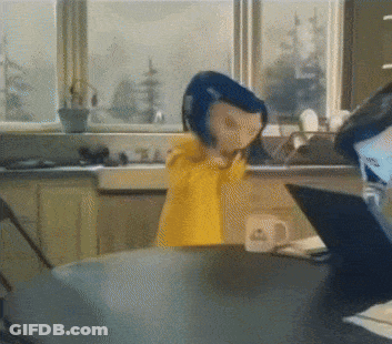 A Doll With Blue Hair Is Standing In Front Of A Window GIF
