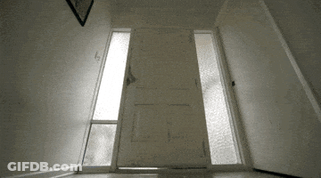A Door That Is Open And Has A Picture On The Wall Above It GIF