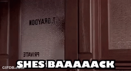 A Door With A Sign On It That Says She 'S Baaaack . GIF