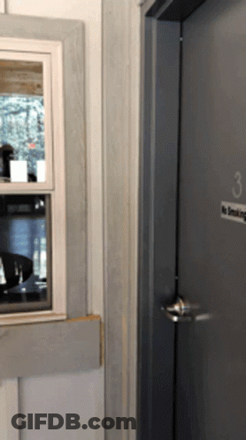 A Door With The Number 3 On It And A No Smoking Sign GIF