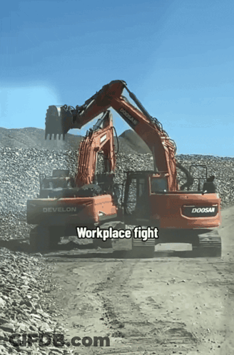 A Doosan Excavator And A Develon Excavator Work Together GIF