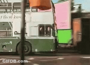 A Double Decker Bus That Says I Them Know On The Side GIF