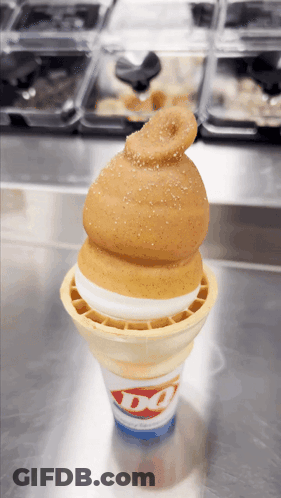 A Dq Ice Cream Cone With A Hamburger On Top GIF