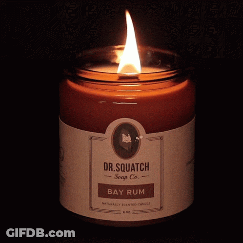 A Dr. Squatch Bay Rum Candle Is Lit Up GIF