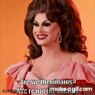 A Drag Queen In A Pink Dress Is Smiling And Says Are We The Villains We 'Re Not The Villains GIF