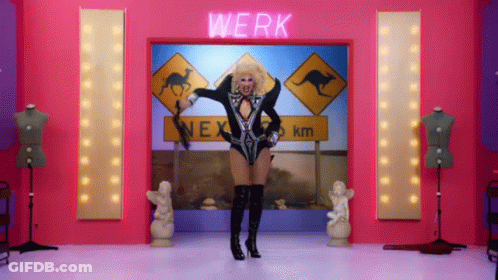 A Drag Queen Is Dancing In Front Of A Sign That Says Werk GIF