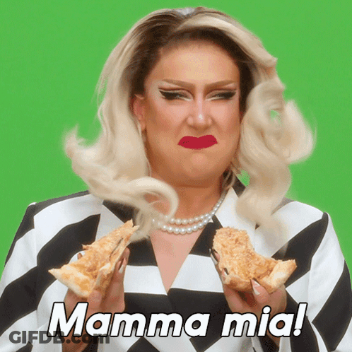 A Drag Queen Is Holding Two Slices Of Pizza With The Words Mamma Mia Written Above Her GIF