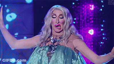 A Drag Queen Is Making A Funny Face While Wearing A Blue Dress On A Stage . GIF