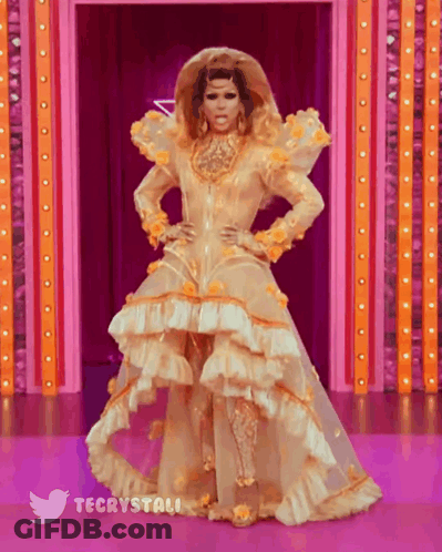 Drag Queen In Gold And White Dress Stage GIF