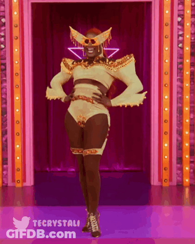 Drag Queen On Stage Wearing Mask GIF
