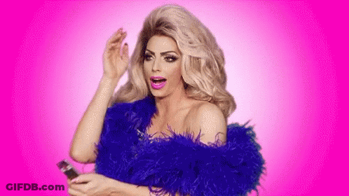 A Drag Queen Is Wearing A Blue Feather Boa And Holding A Phone . GIF