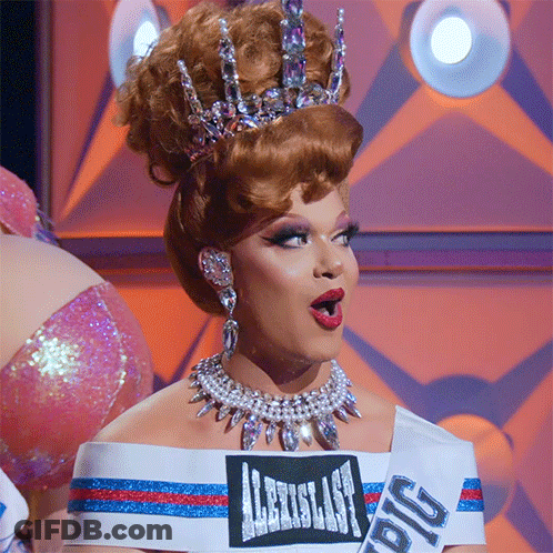 Drag Queen Wearing Crown And Big Pig Sash GIF