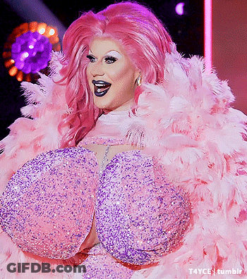 Drag Queen In Pink And Purple Feathered Outfit GIF