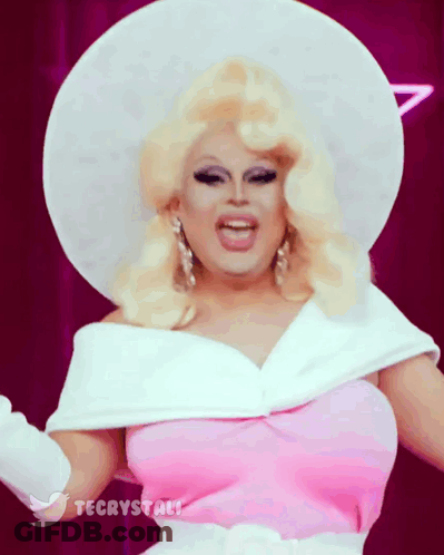 Drag Queen Wearing White Hat And Pink Dress GIF